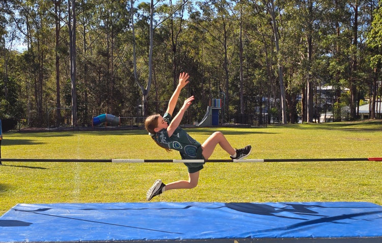 student doing the high jump