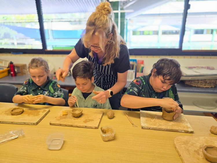 Students and teacher in art class